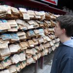 KCP student in front of temple wishes