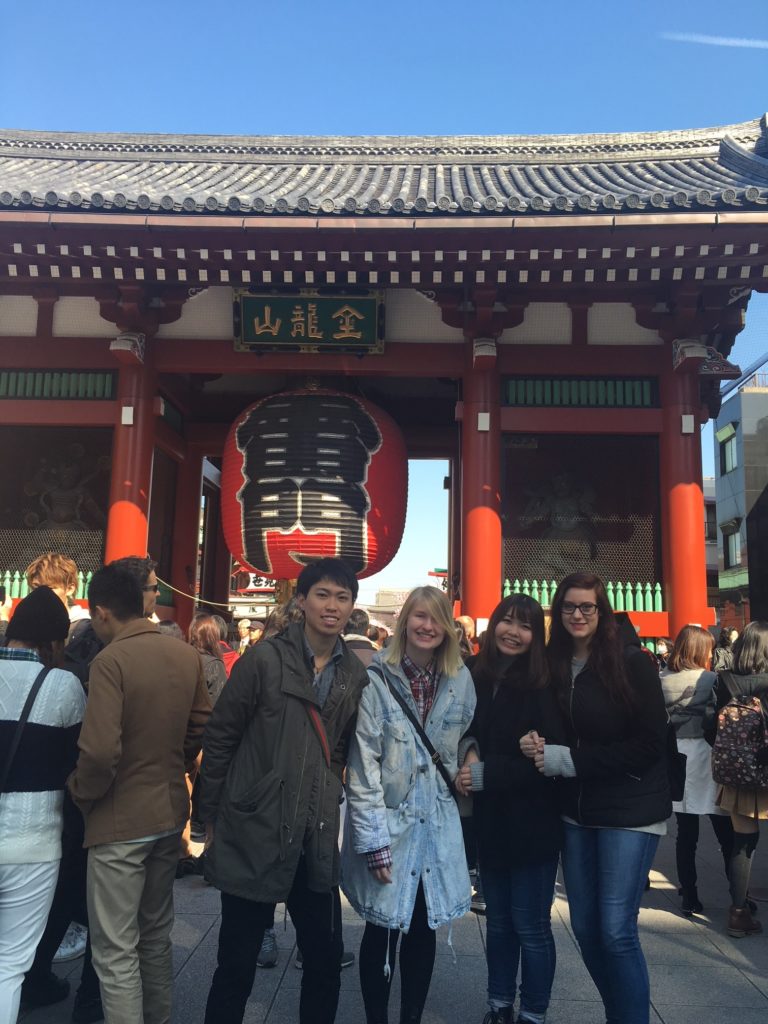 Abigail Dunn and other KCP Alumni in Japan In front of a temple