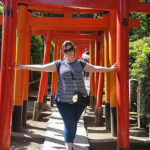 KCP International Language School Student Poses At the torii gates at Nezu Shrine